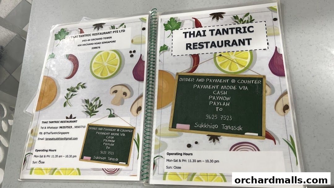 A menu from Thai Tantric Restaurant showing contact details and payment information.