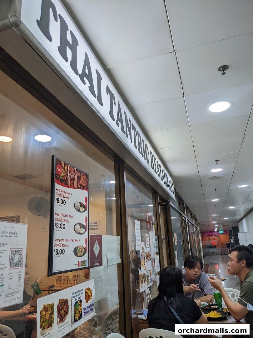 Exterior of Thai Tantric Restaurant with a menu displayed in the window.