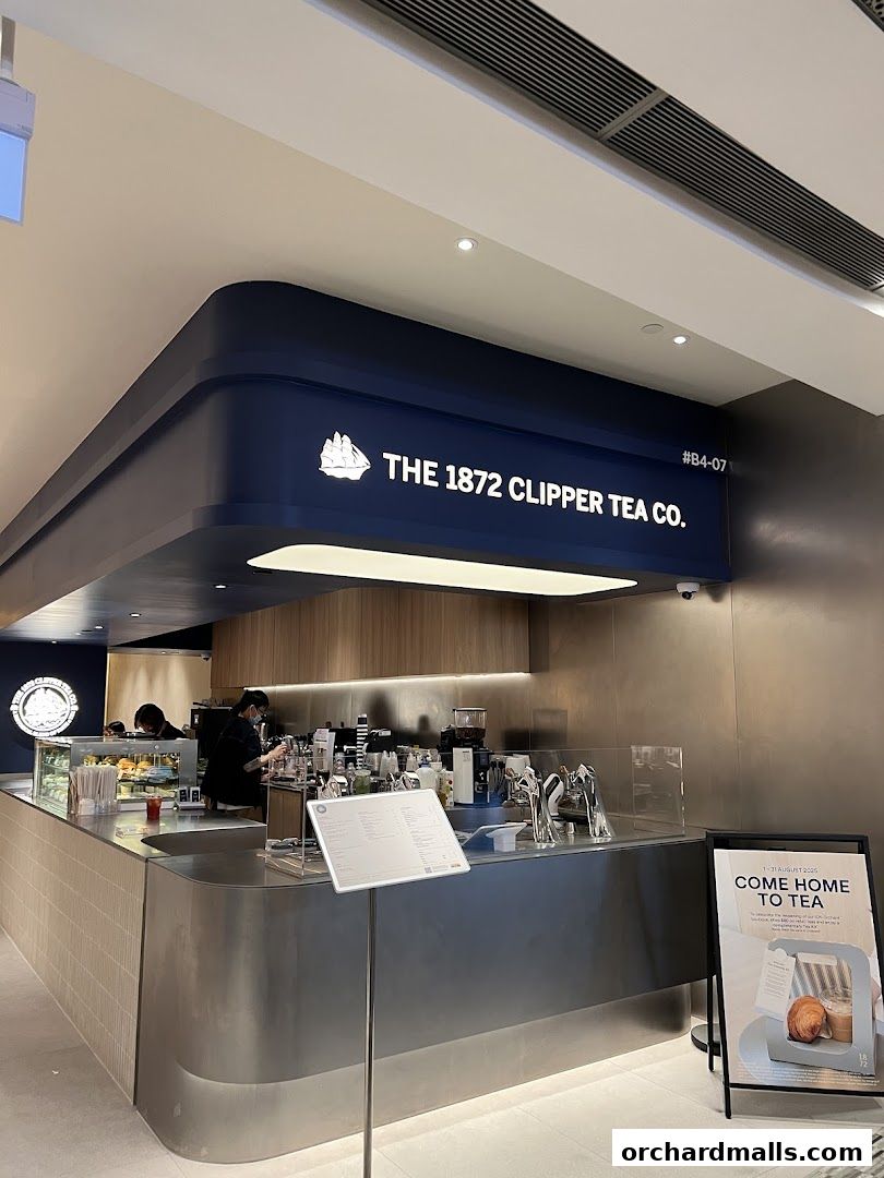 The 1872 Clipper Tea Co. shop front with a counter, menu, and promotional signage.