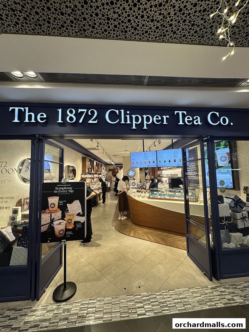 The entrance of The 1872 Clipper Tea Co. shop with a display of drinks and gifts.