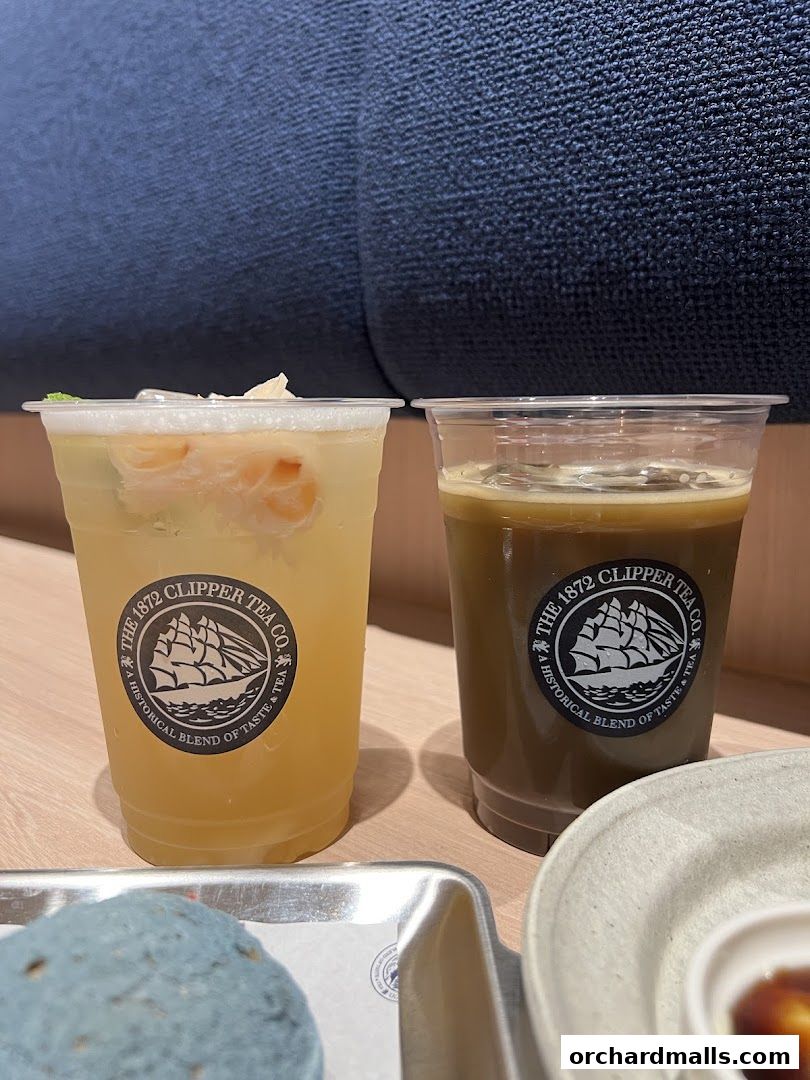 Two refreshing drinks from The 1872 Clipper Tea Co. with fruit and ice.