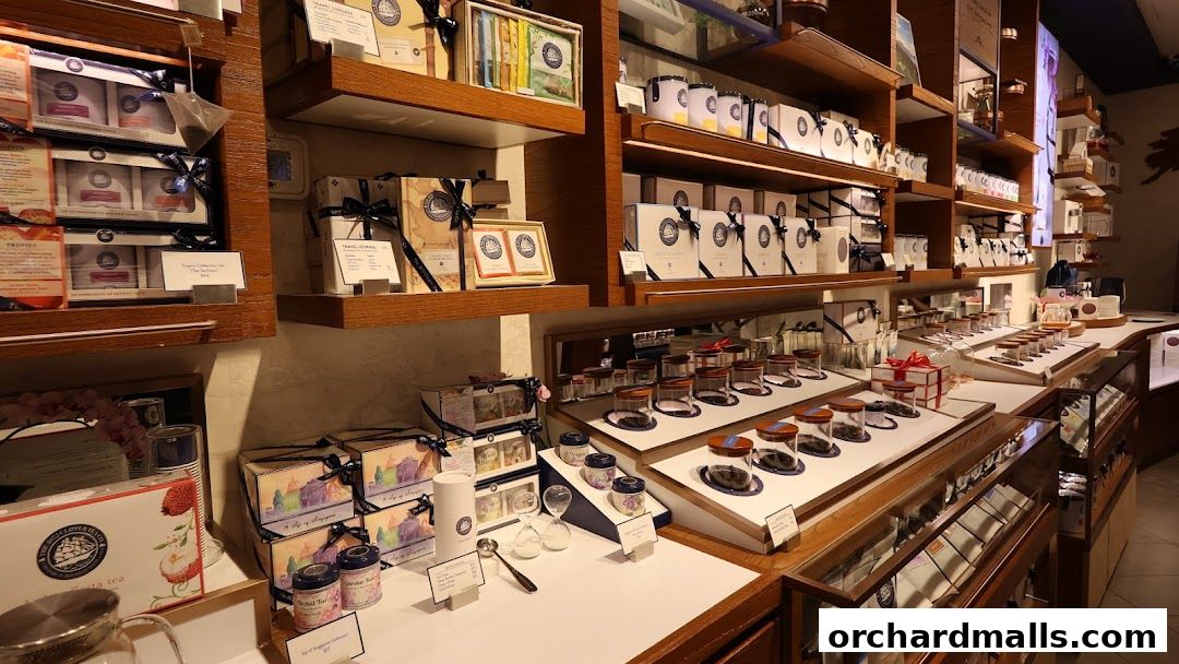 Interior view of a tea shop with shelves displaying various tea products and gift sets.