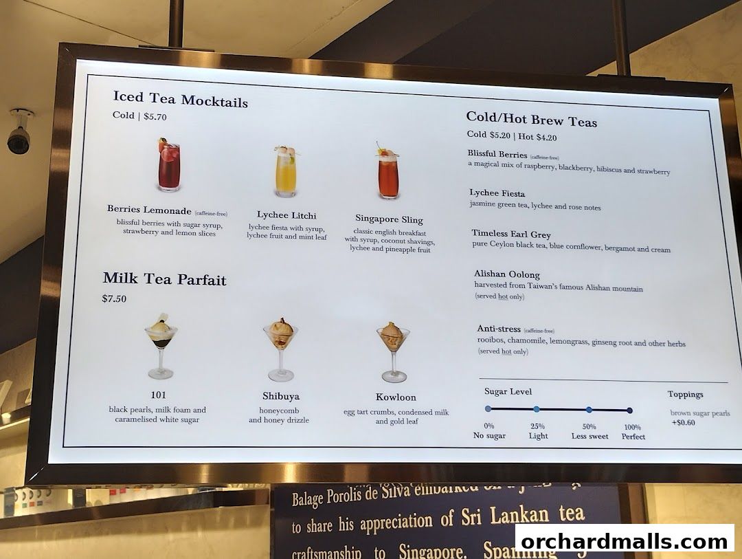 A digital menu displaying iced tea mocktails, milk tea parfaits, and cold/hot brew teas with descriptions and prices.