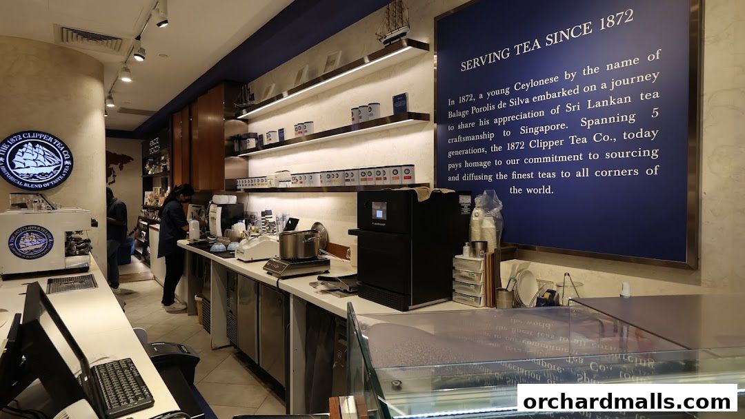 Interior of a tea shop with shelves of tea products and a service counter.