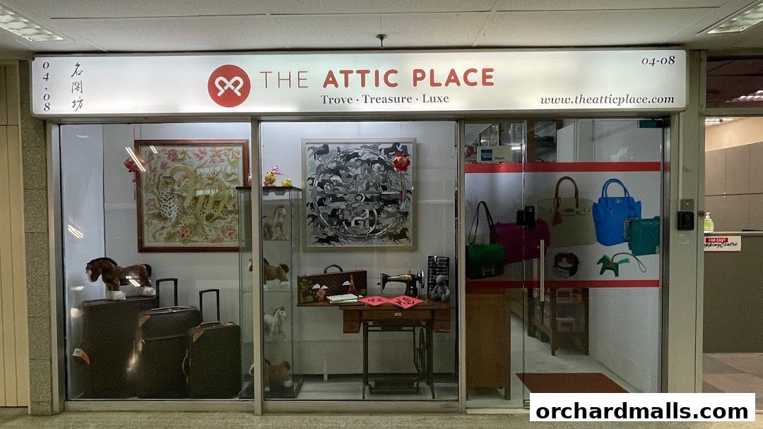 The Attic Place shop front displays art, luggage, handbags, and decorative items.