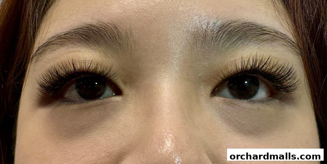 Close-up of a woman's eyes with dramatic, voluminous false eyelashes.