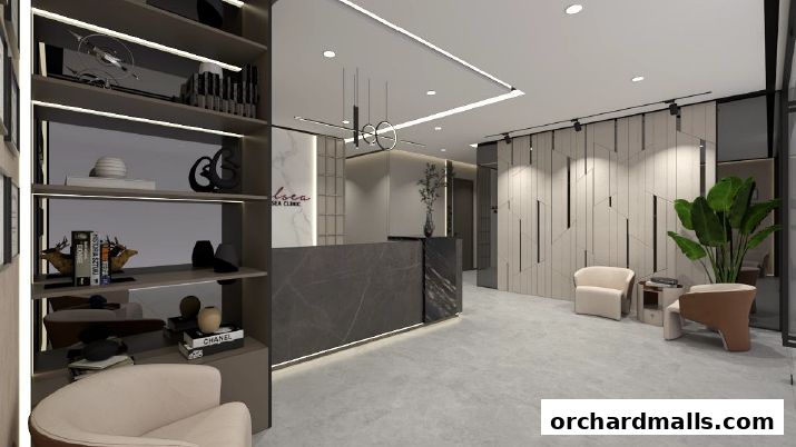 Modern reception area of The Chelsea Clinic with a marble desk and stylish seating.