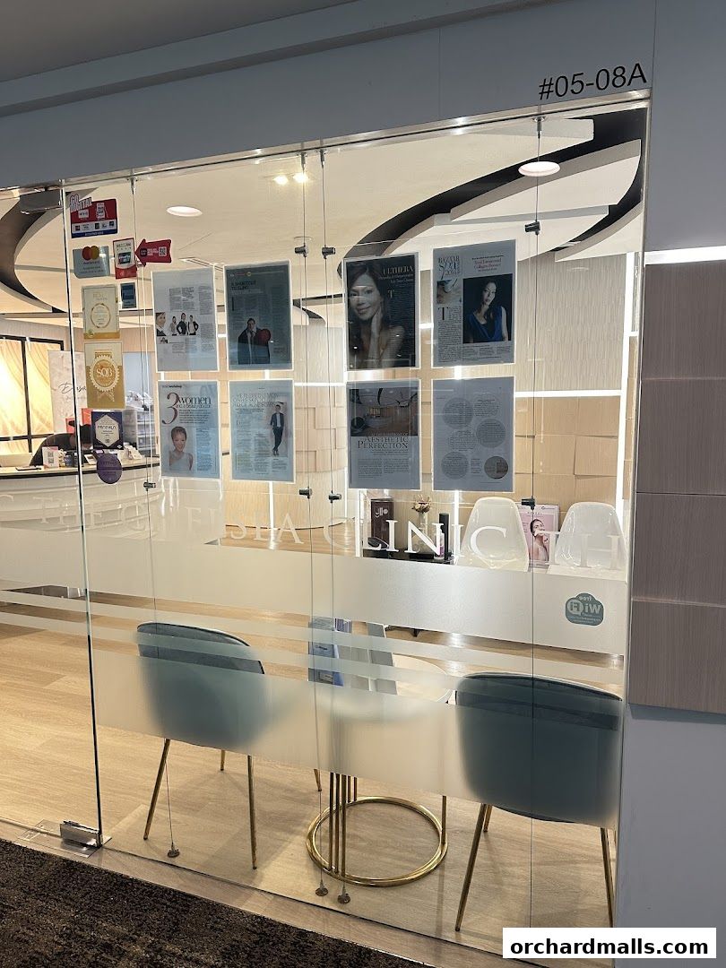 The Chelsea Clinic's entrance with frosted glass doors and displayed articles.