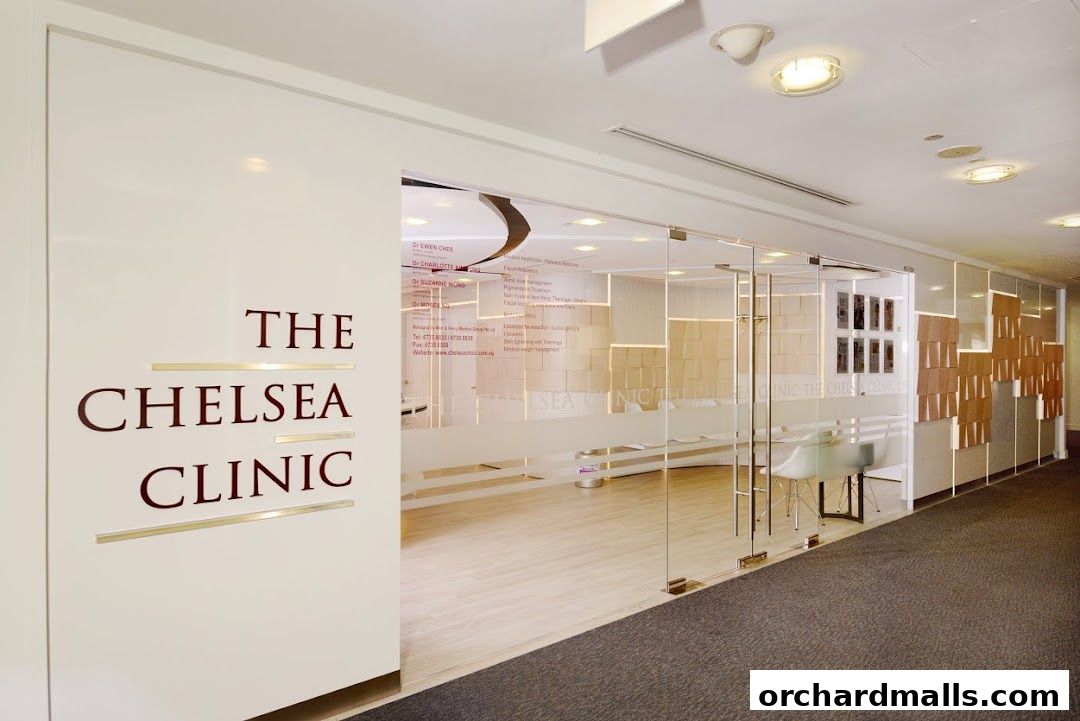 The entrance to The Chelsea Clinic, a modern medical spa with glass doors and elegant signage.