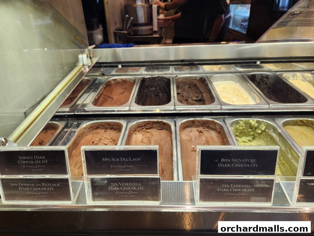 A display case filled with various flavors of ice cream and sorbet.