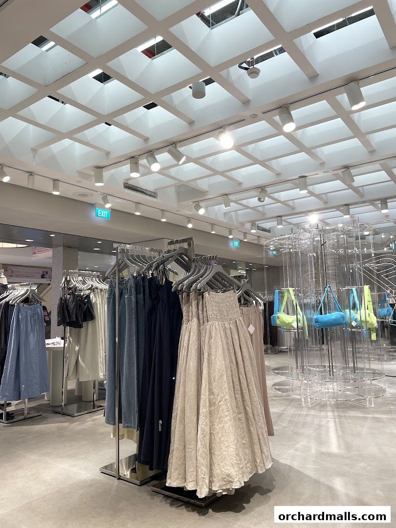 Interior view of The Editors Market clothing store with racks of apparel and display shelves.