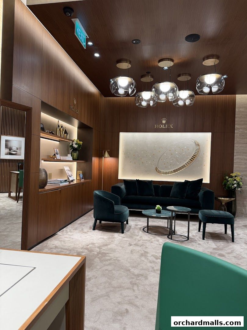 Luxurious interior of a Rolex and Patek Philippe retailer with plush seating and elegant lighting.