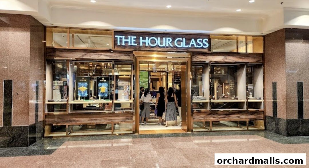 The Hour Glass, a luxury watch retailer, with displays of Rolex and Patek Philippe timepieces.