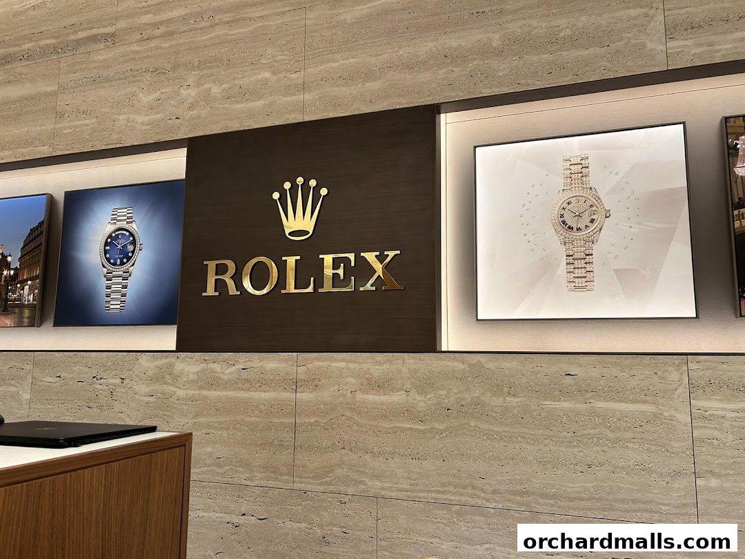Rolex branding and watch displays inside a luxury watch retailer.