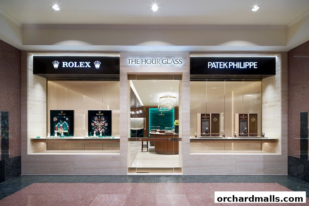 The Hour Glass, a luxury watch retailer, showcases Rolex and Patek Philippe timepieces.