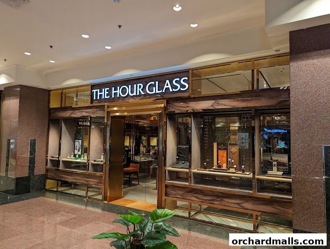The Hour Glass, a luxury watch retailer, showcases its exquisite timepieces in a well-lit storefront.