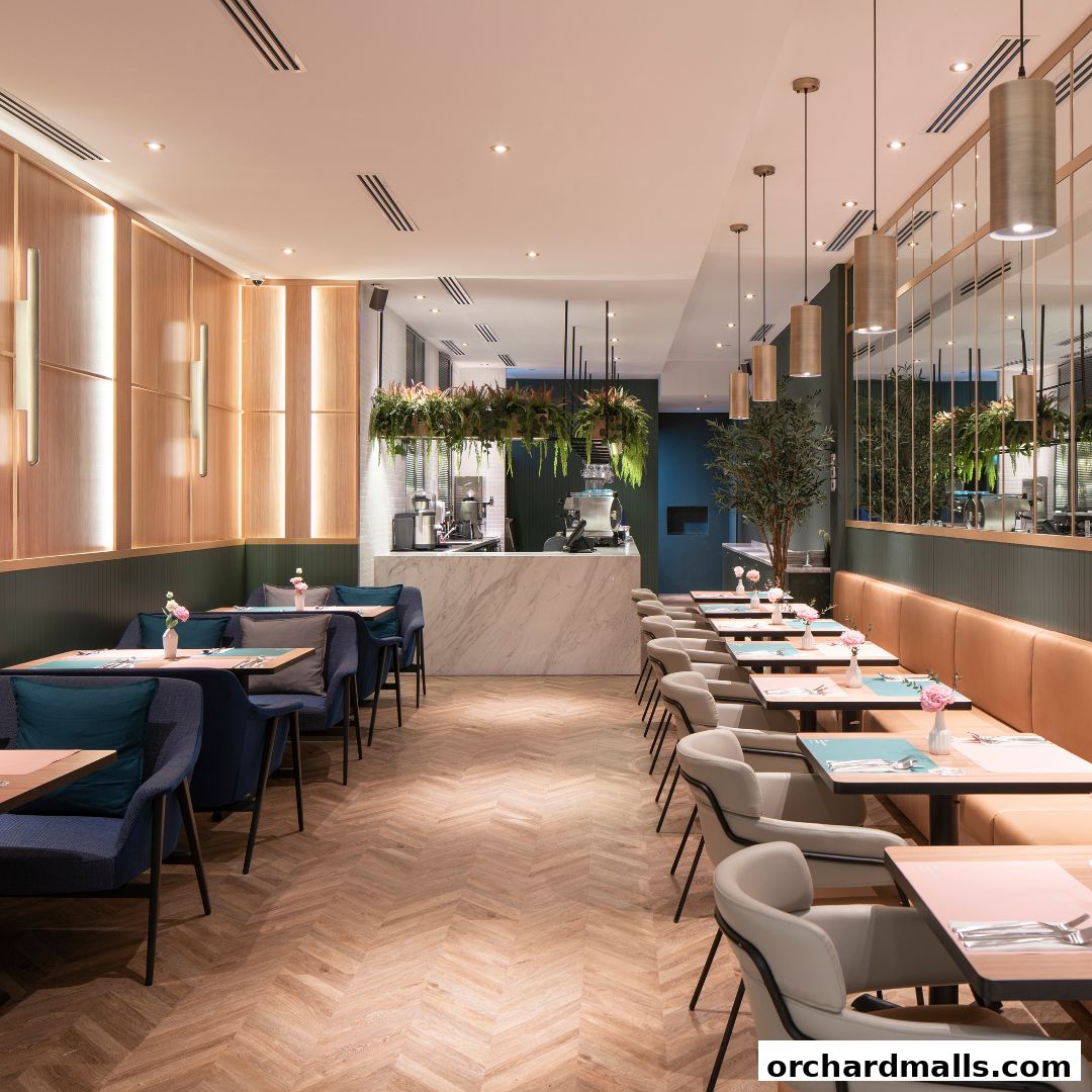 Interior of a modern cafe bistro with elegant seating and a marble counter.