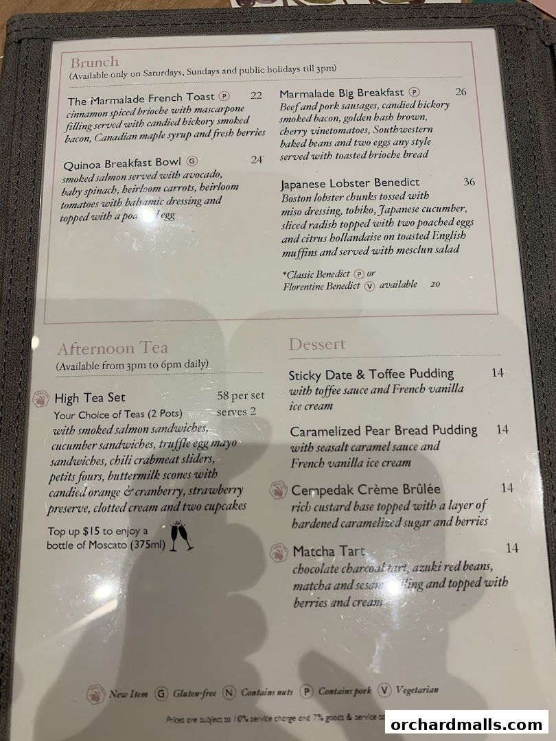 A menu from The Marmalade Pantry featuring brunch, afternoon tea, and dessert options.