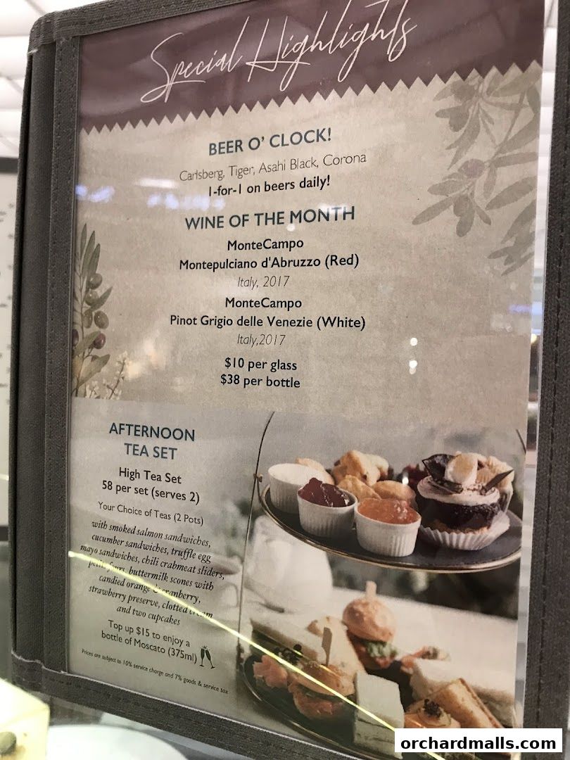 A menu highlighting beer specials, wine of the month, and an afternoon tea set with pastries and sandwiches.