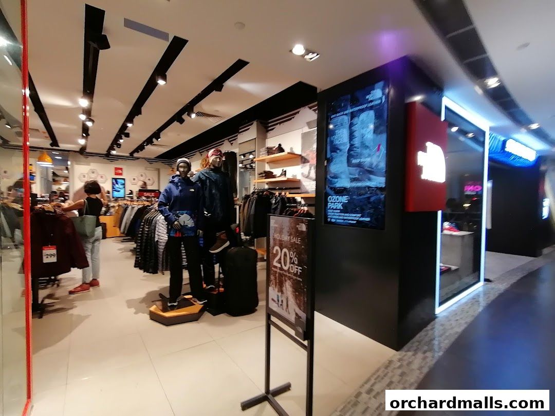 Interior view of The North Face store with mannequins, clothing racks, and promotional displays.