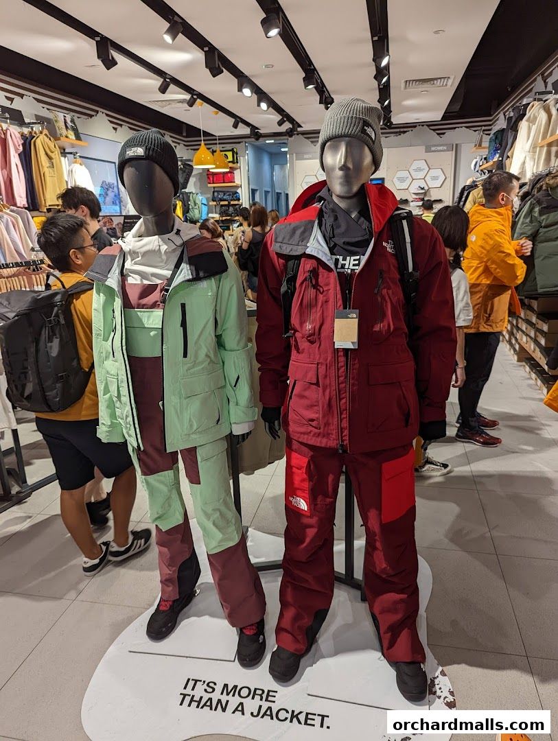 Mannequins display winter jackets and pants inside a North Face store.