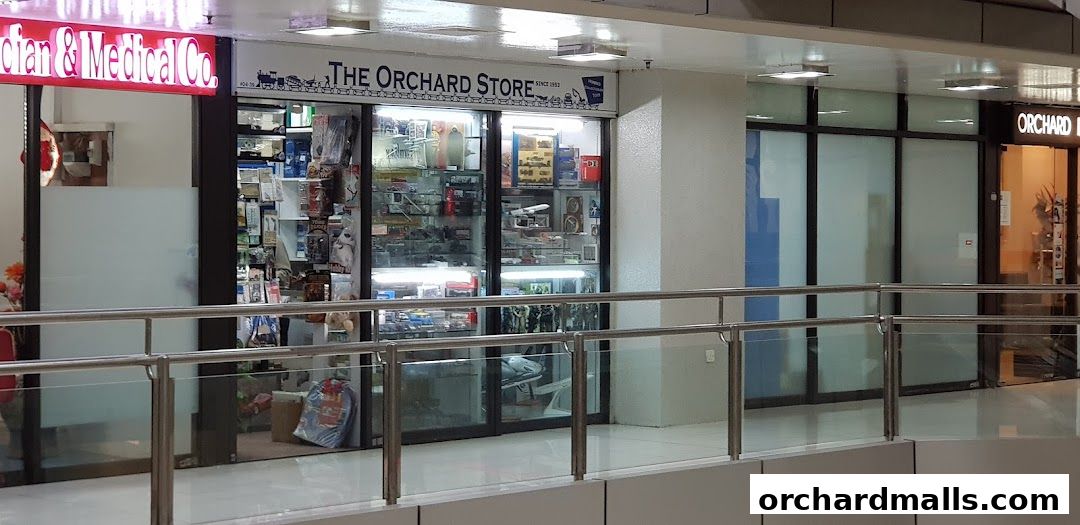 The Orchard Store, a shop selling various collectibles and models, is displayed with its storefront.