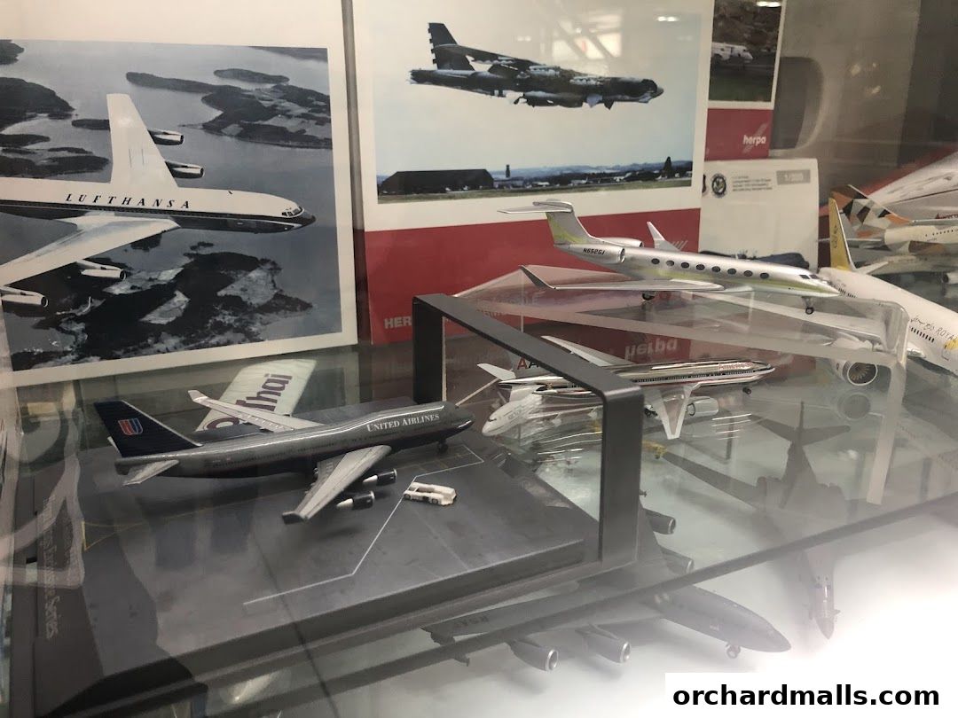 Display of various airplane models and aviation-themed artwork.