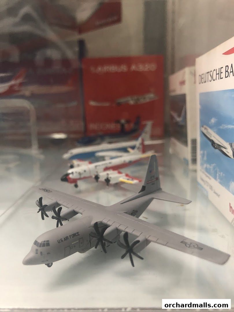 Display of detailed model airplanes, including a U.S. Air Force transport plane.
