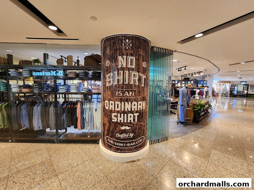 The Shirt Bar shop entrance with shirts and suits displayed.