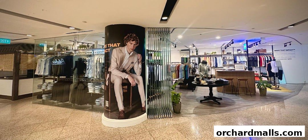 Interior view of The Shirt Bar, showcasing men's apparel and a large promotional poster.