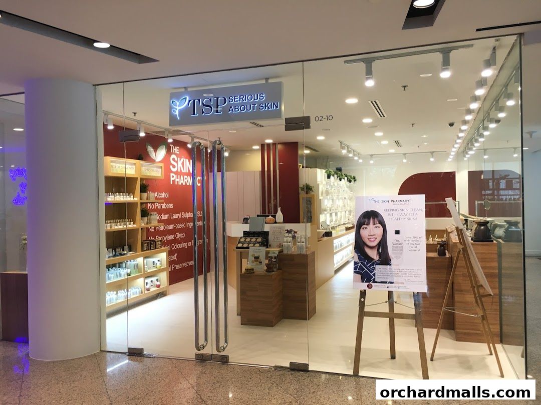 The Skin Pharmacy storefront with products displayed on shelves and a promotional poster.