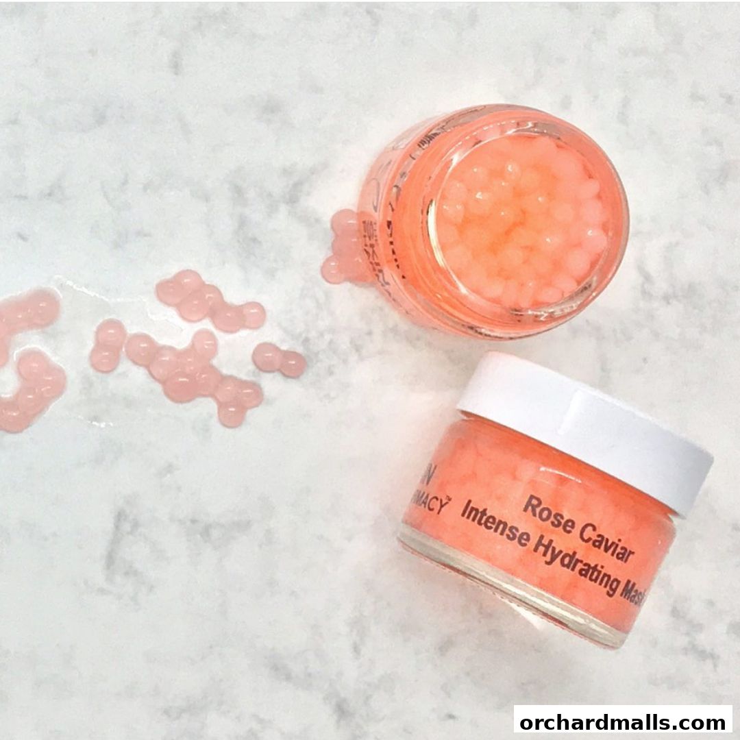 Two jars of The Skin Pharmacy's Rose Caviar Intense Hydrating Mask with scattered beads.