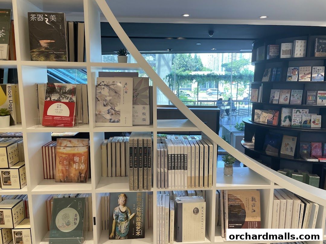Interior view of a modern bookstore with shelves filled with books and decorative items.