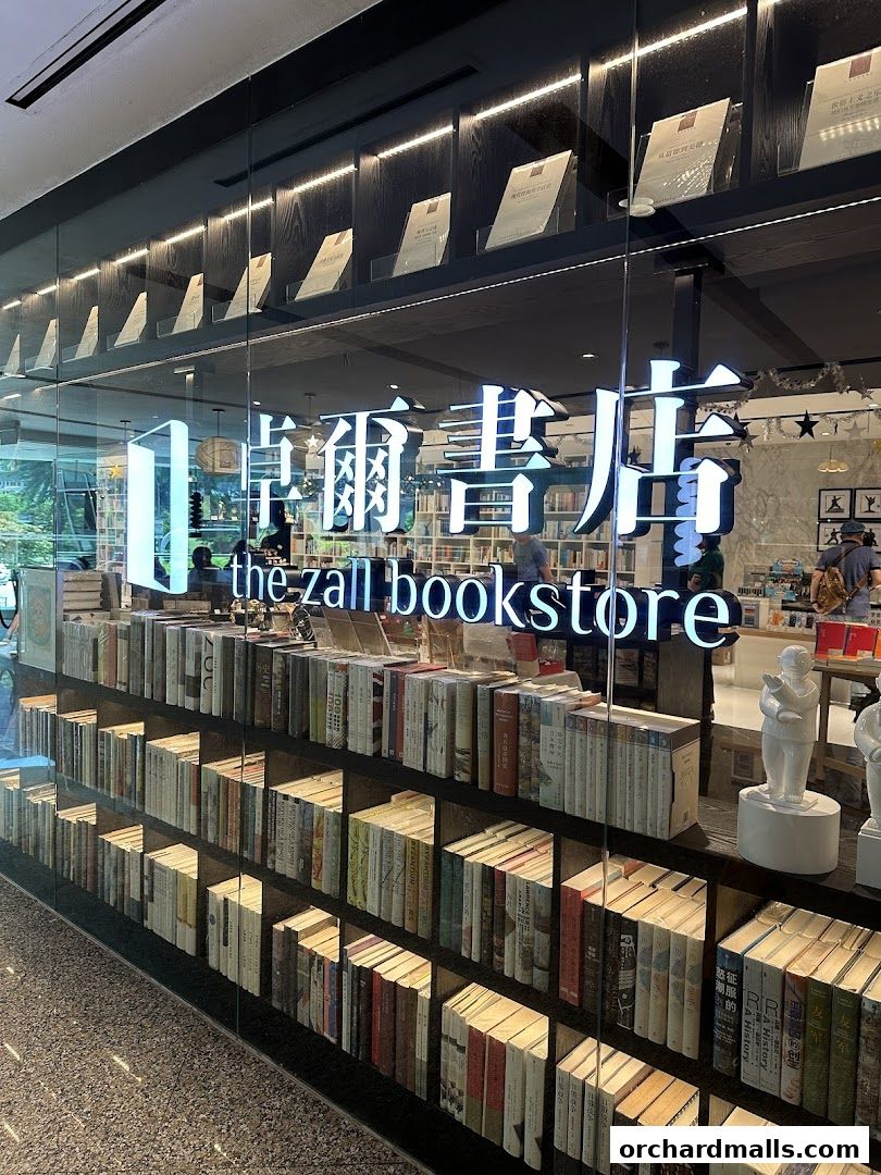 The Zall Bookstore entrance with shelves full of books and illuminated displays.