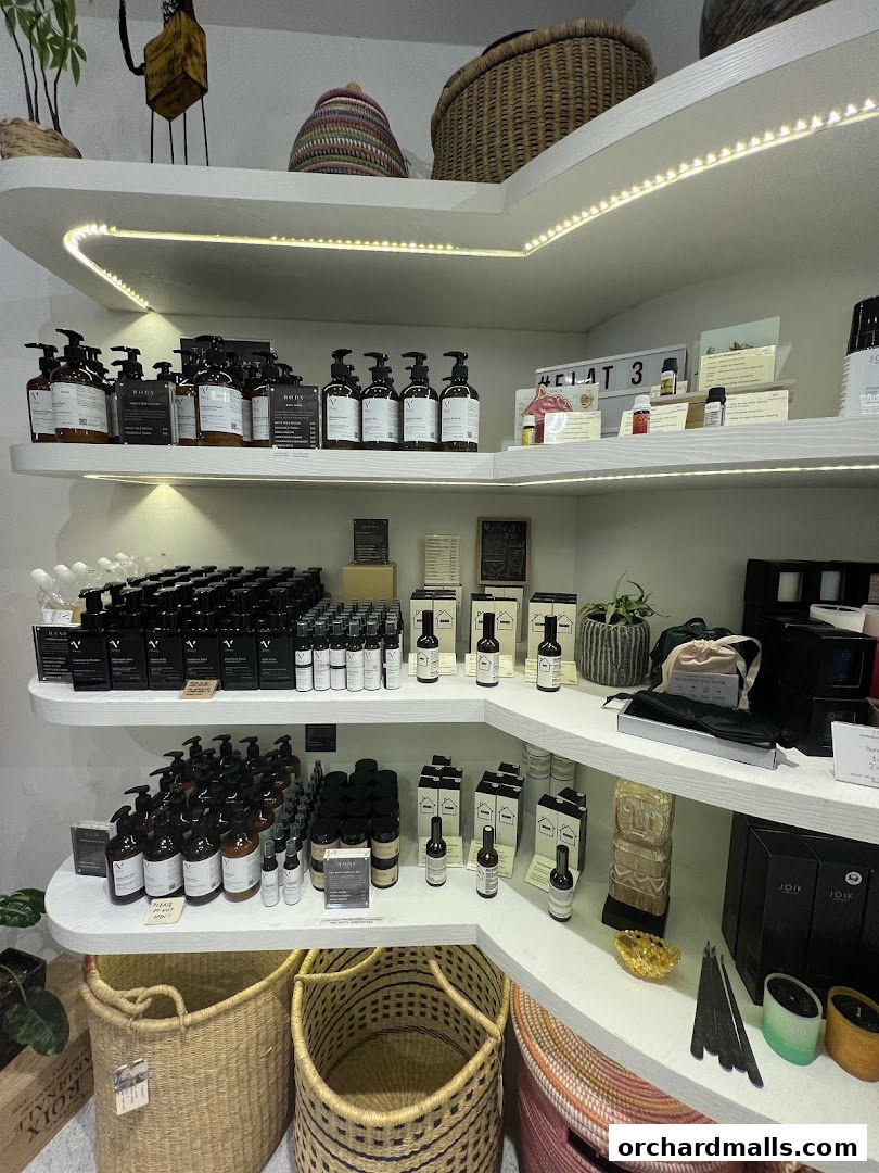 Shelves stocked with various skincare and wellness products, including bottles and baskets.
