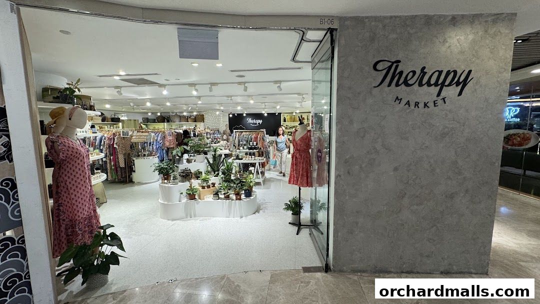 The entrance to Therapy Market, showcasing clothing, plants, and accessories.