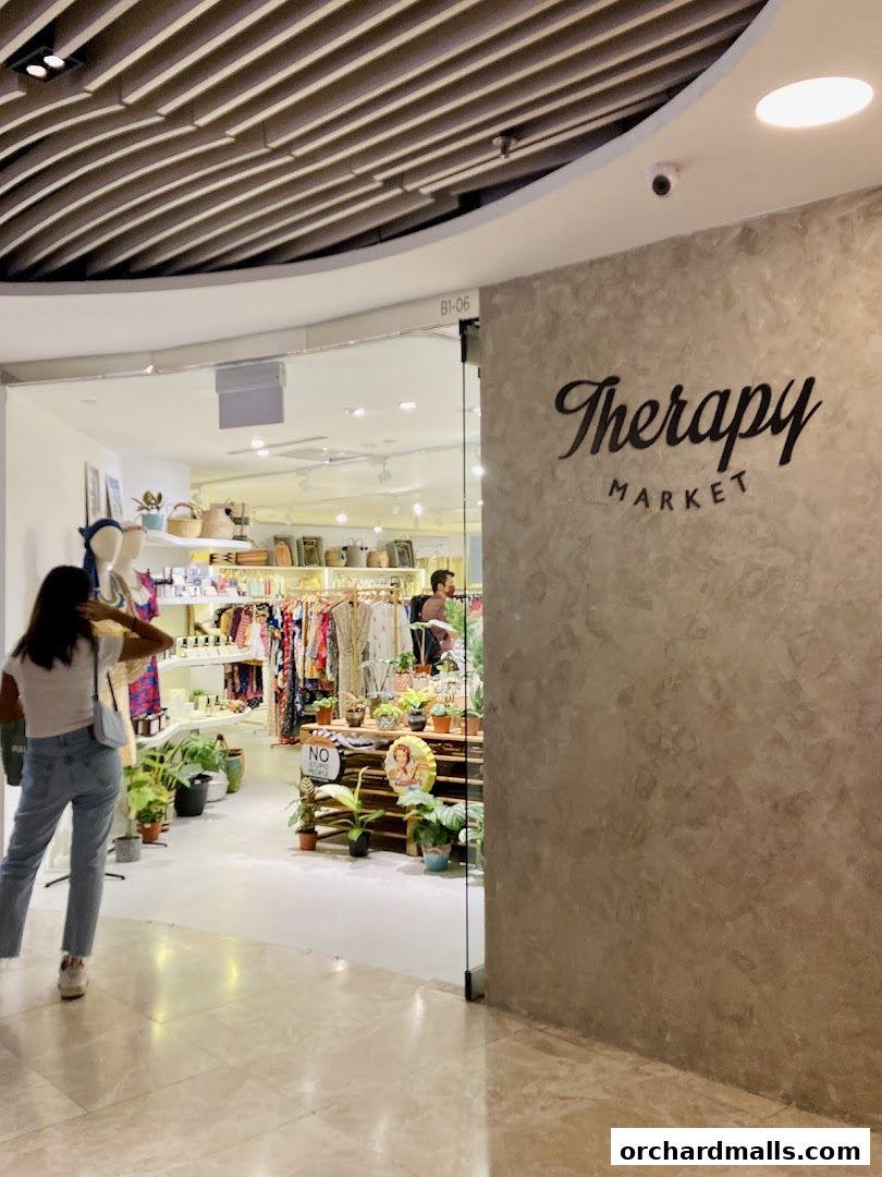 Entrance to Therapy Market at Wheelock Place, showcasing clothing, plants, and decor.