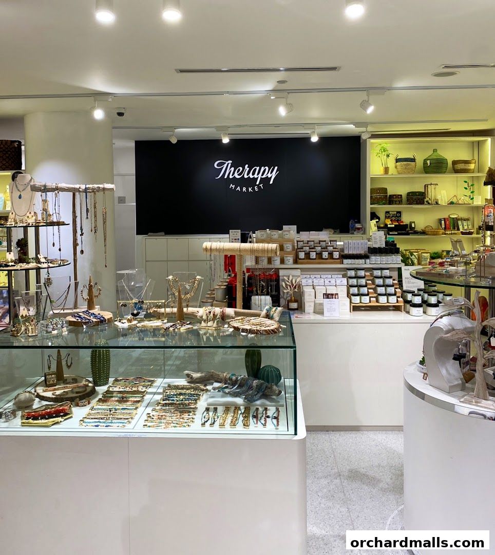 Interior view of Therapy Market showcasing jewelry, candles, and decorative items.