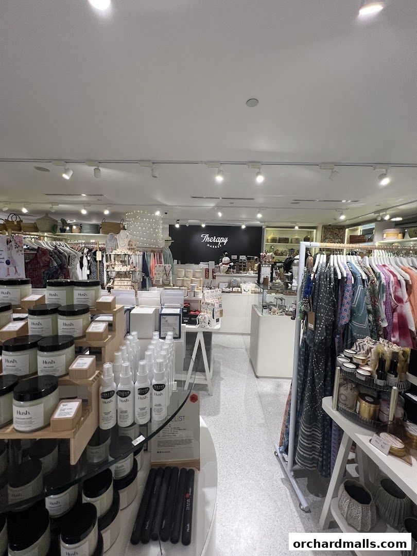 Interior view of Therapy Market at Wheelock Place, showcasing clothing and wellness products.