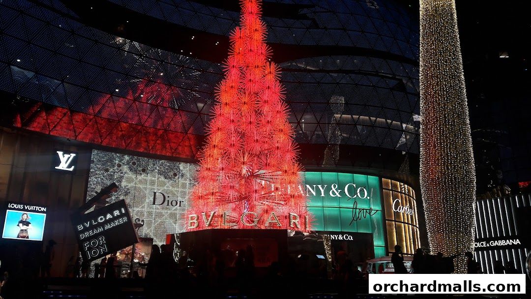 Luxury brand storefronts illuminated at night with festive Christmas trees.