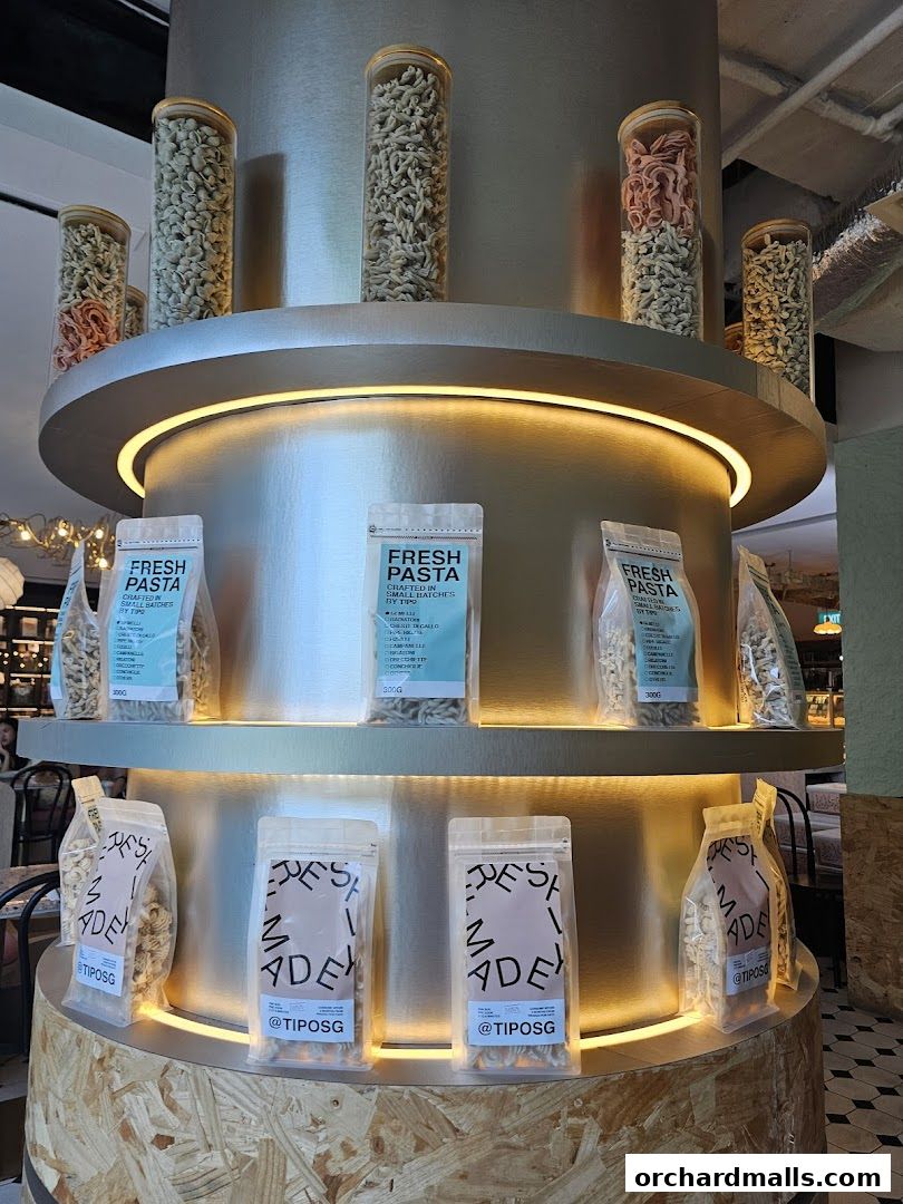 Display of fresh pasta in glass jars and packaging at Tipo Strada Wheelock.