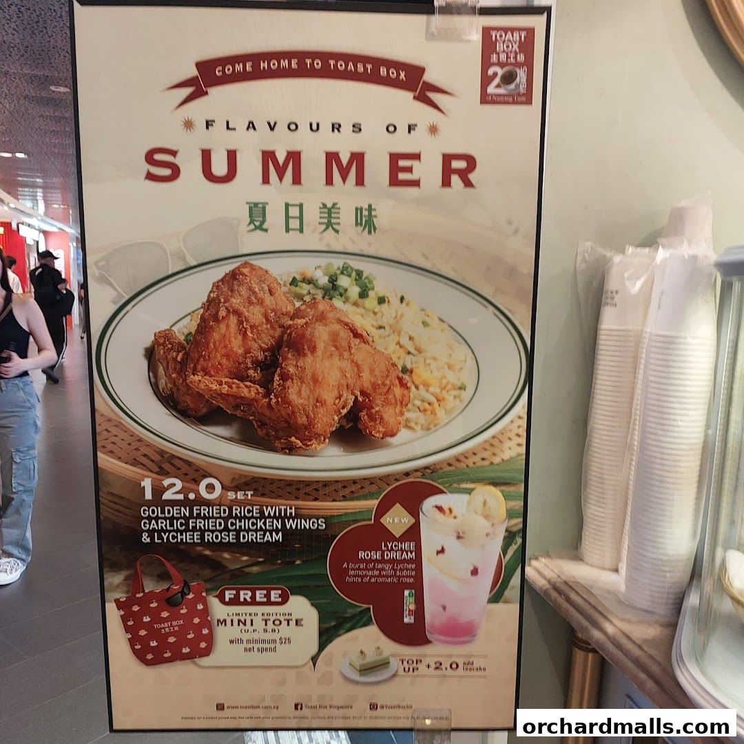 A promotional poster for Toast Box featuring a summer special with fried chicken and a lychee drink.