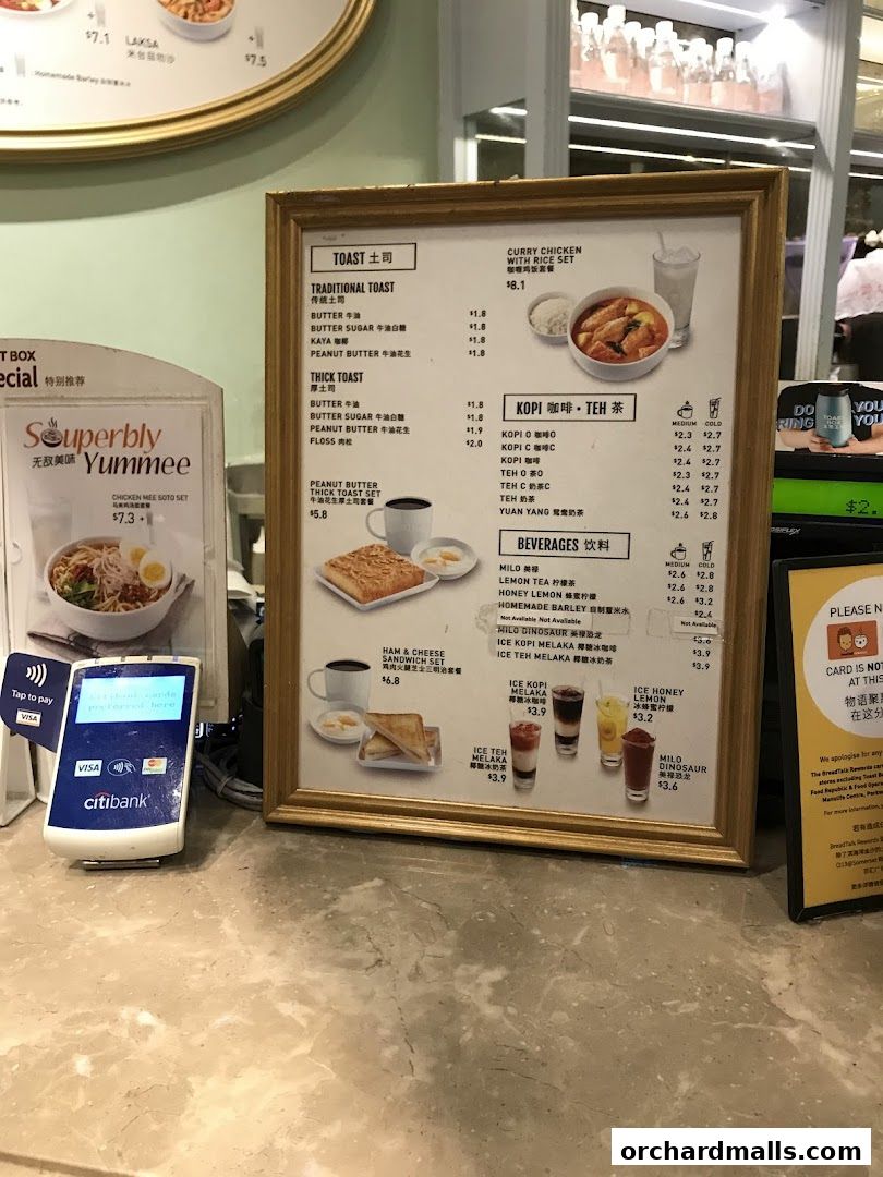A menu board displaying various toast, coffee, tea, and beverage options with prices.