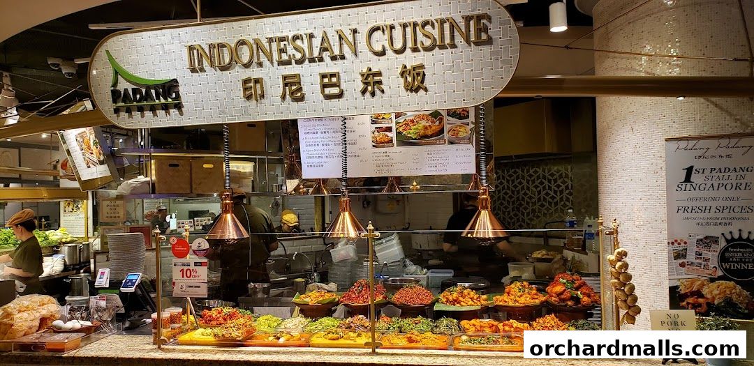 A vibrant display of Indonesian cuisine with various dishes and a prominent sign.
