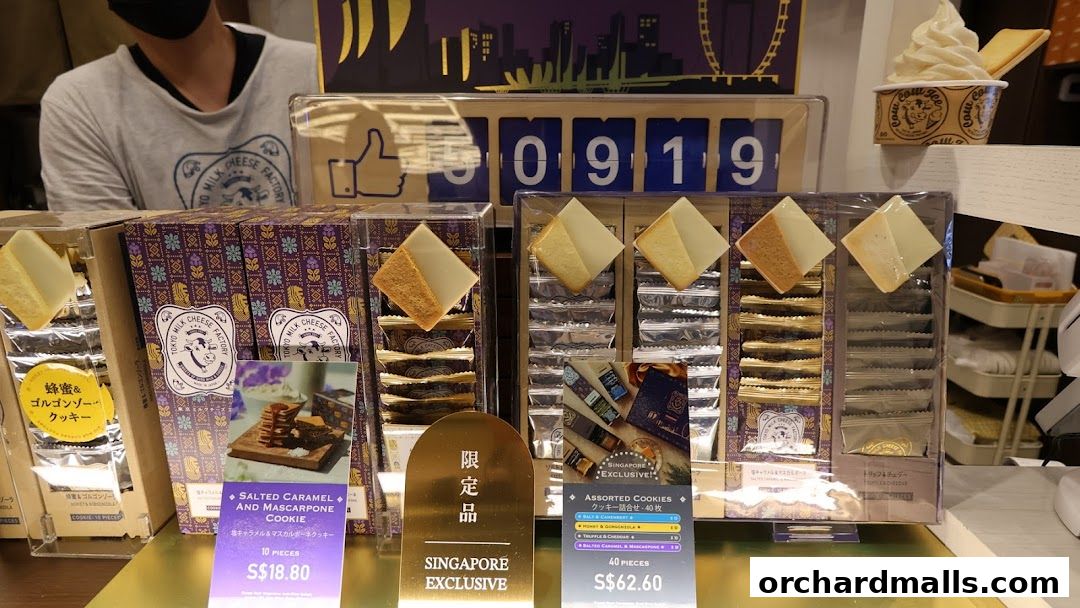 Tokyo Milk Cheese Factory display featuring assorted cookies and a soft-serve ice cream.