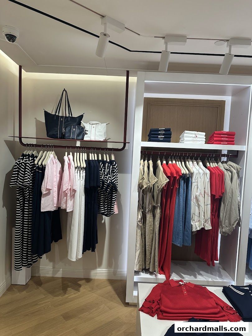 Interior view of a Tommy Hilfiger store showcasing a variety of clothing and accessories.