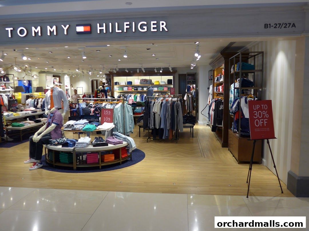 Interior view of a Tommy Hilfiger store with clothing displays and mannequins.