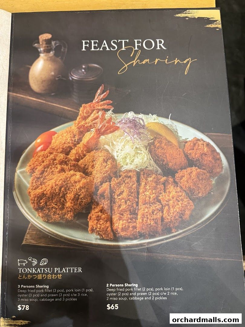 A menu page showcasing a large platter of Tonkatsu dishes for sharing.