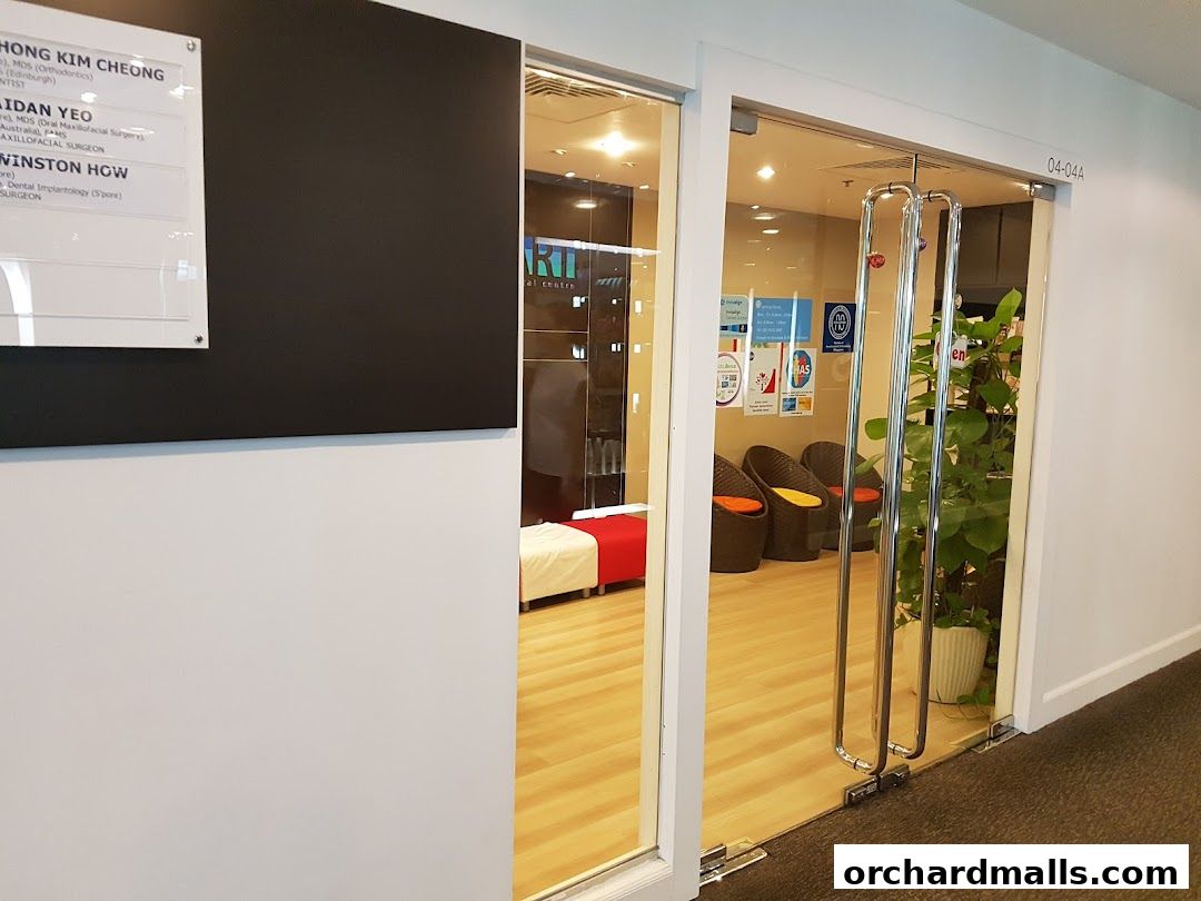 Entrance to Tooth Art Dental Centre with a list of dentists and a waiting area visible inside.