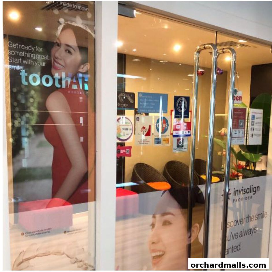 Exterior view of Tooth Art Dental Centre with promotional posters and signage.
